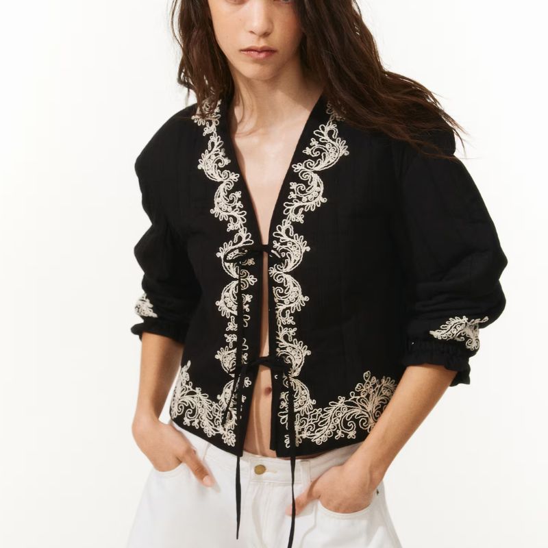 black jacket with white embroidery
