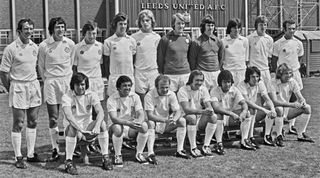 League Division One team Leeds United FC at Elland Road in Leeds, at the start of the 1974-75 football season, UK, 26th July 1974. From left to right (back row) Paul Madeley, Norman Hunter, Trevor Cherry, Joe Jordan, Gordon McQueen, David Stewart, David Harvey, Eddie Gray, Allan Clarke and Paul Reaney; Peter Lorimer, Johnny Giles, Billy Bremner, Terry Cooper, Mick Bates, Frankie Gray and Terry Yorath. (Photo by Evening Standard/Hulton Archive/Getty Images)