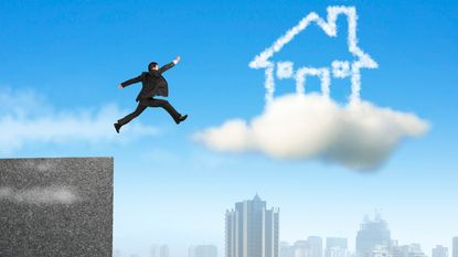 A man leaps from the roof of a high-rise toward a floating house made of clouds.