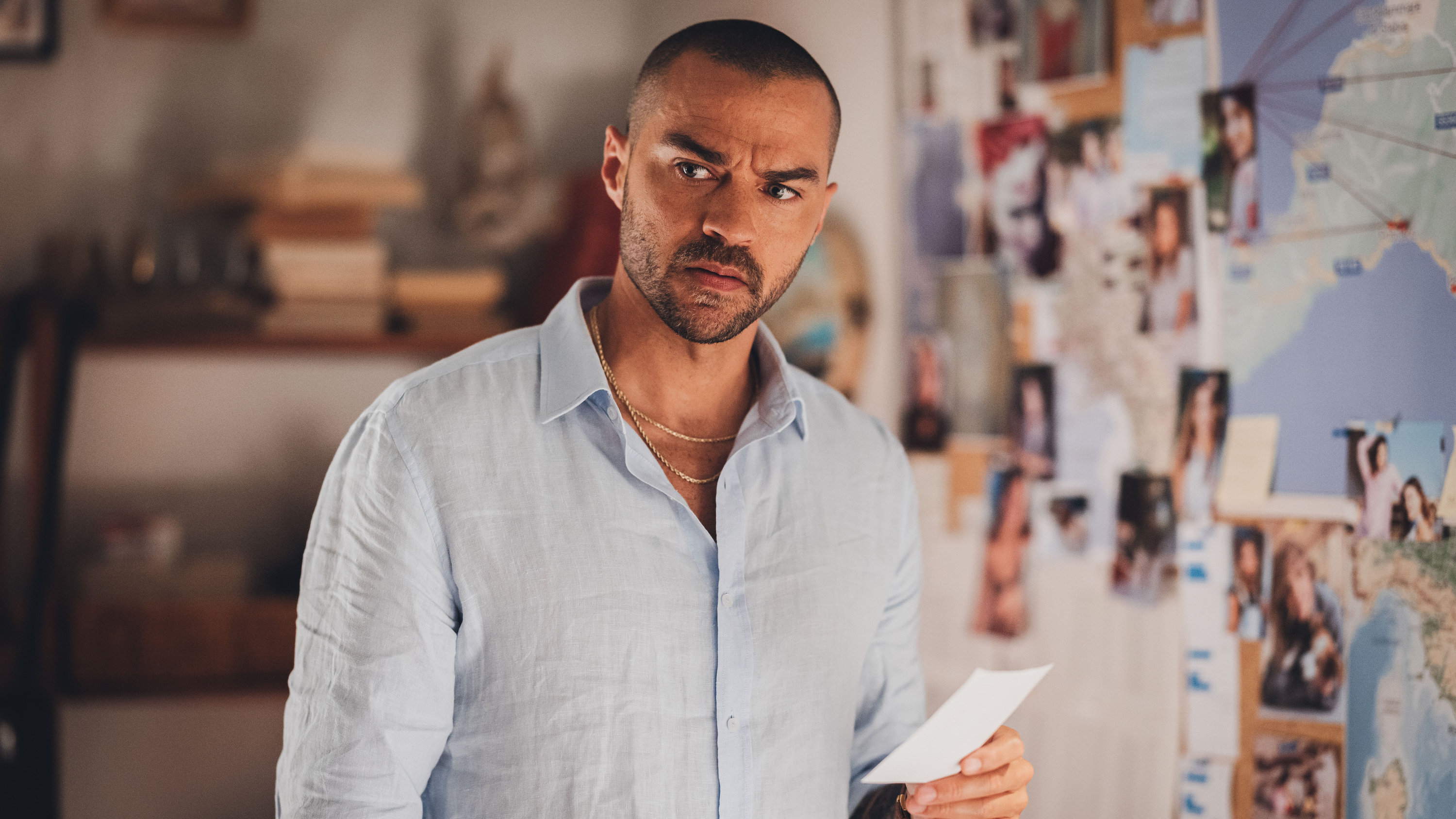 Jesse Williams stands in front of an incident board in a scene from &quot;Hotel Costiera&quot;