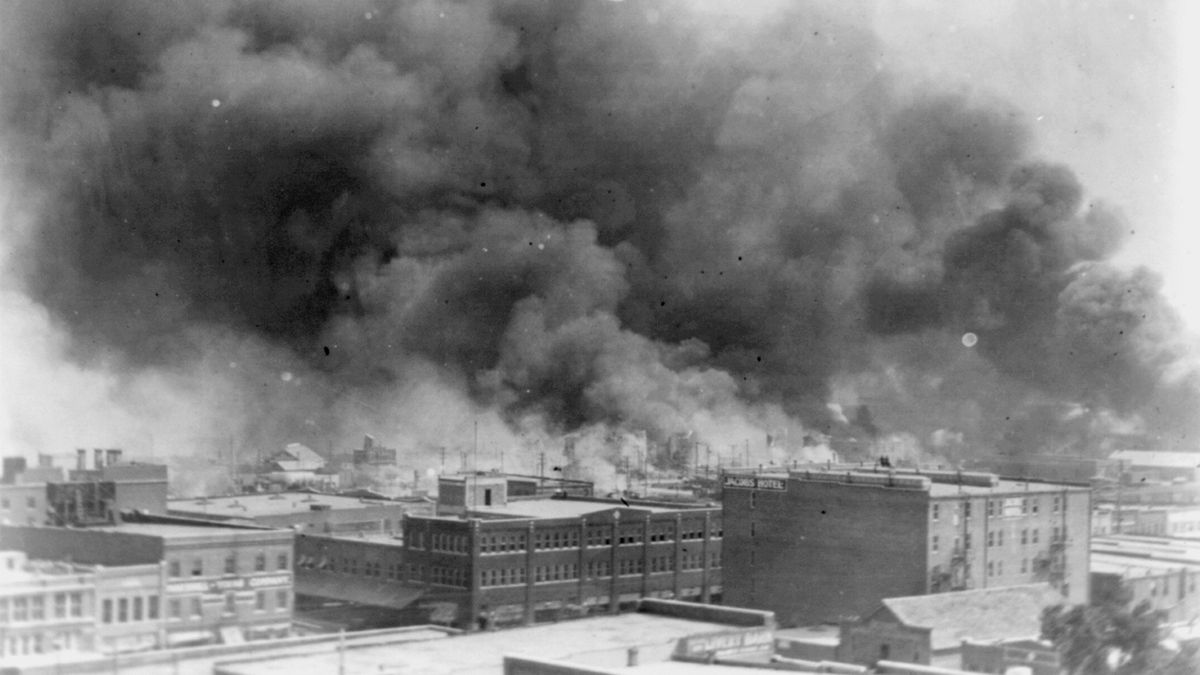 Buildings on fire in Tulsa, Oklahoma during the 1921 Tulsa race massacre 