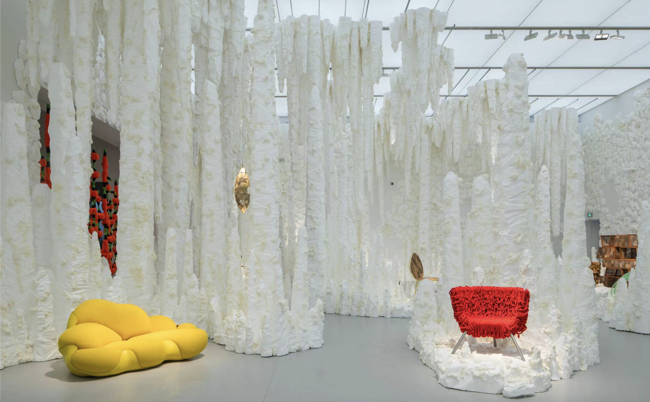 Estúdio Campana exhibition installed in shanghai, with a white foamy background and colourful furniture in the foreground