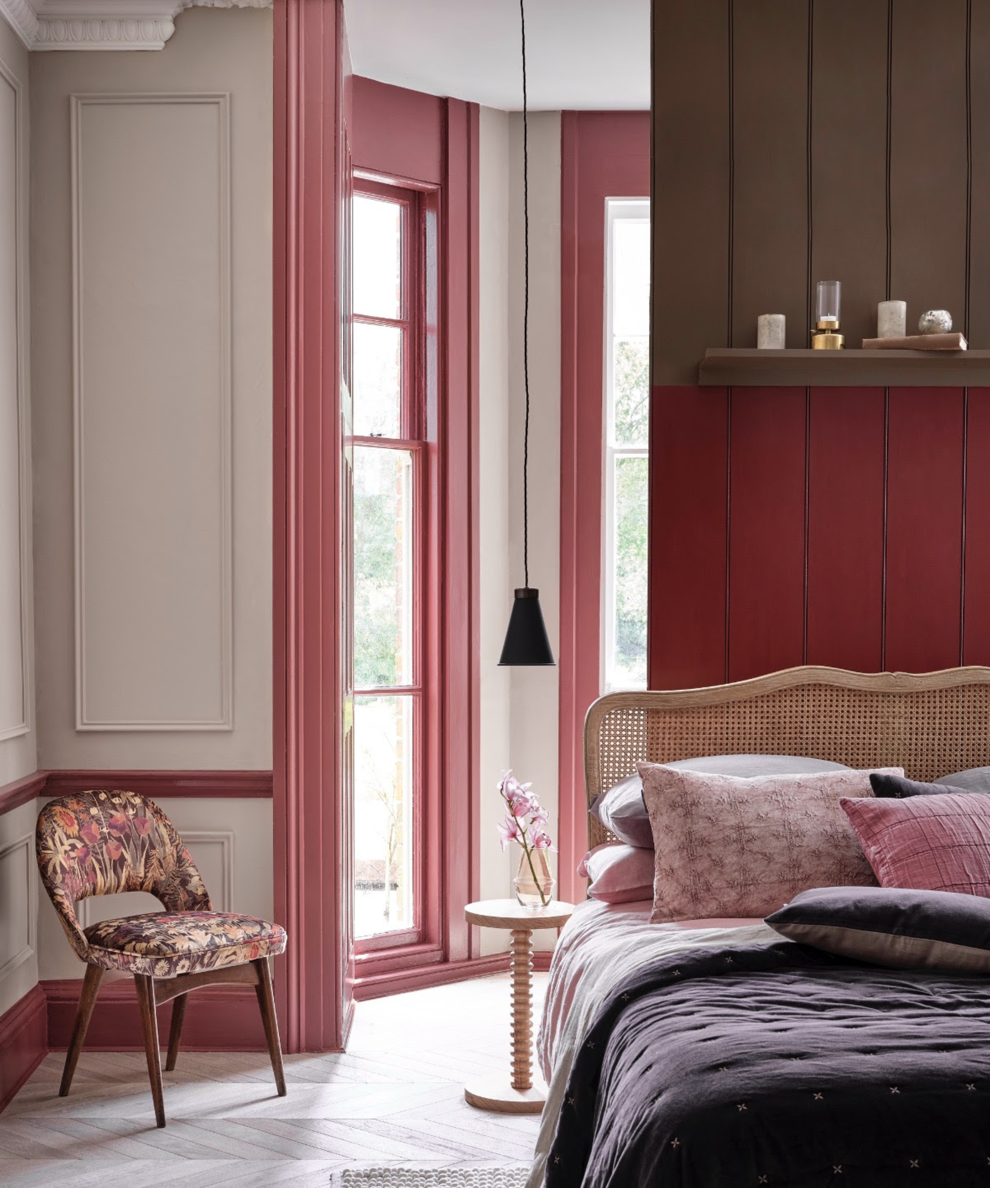 bedroom with large windows and a red and pink colour scheme