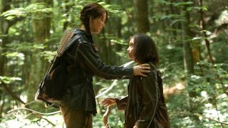 Jennifer Lawrence and Amandla Stenberg as Katniss and Rue in The Hunger Games