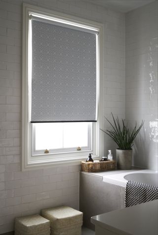 Moroccan print black out blind in a small bathroom