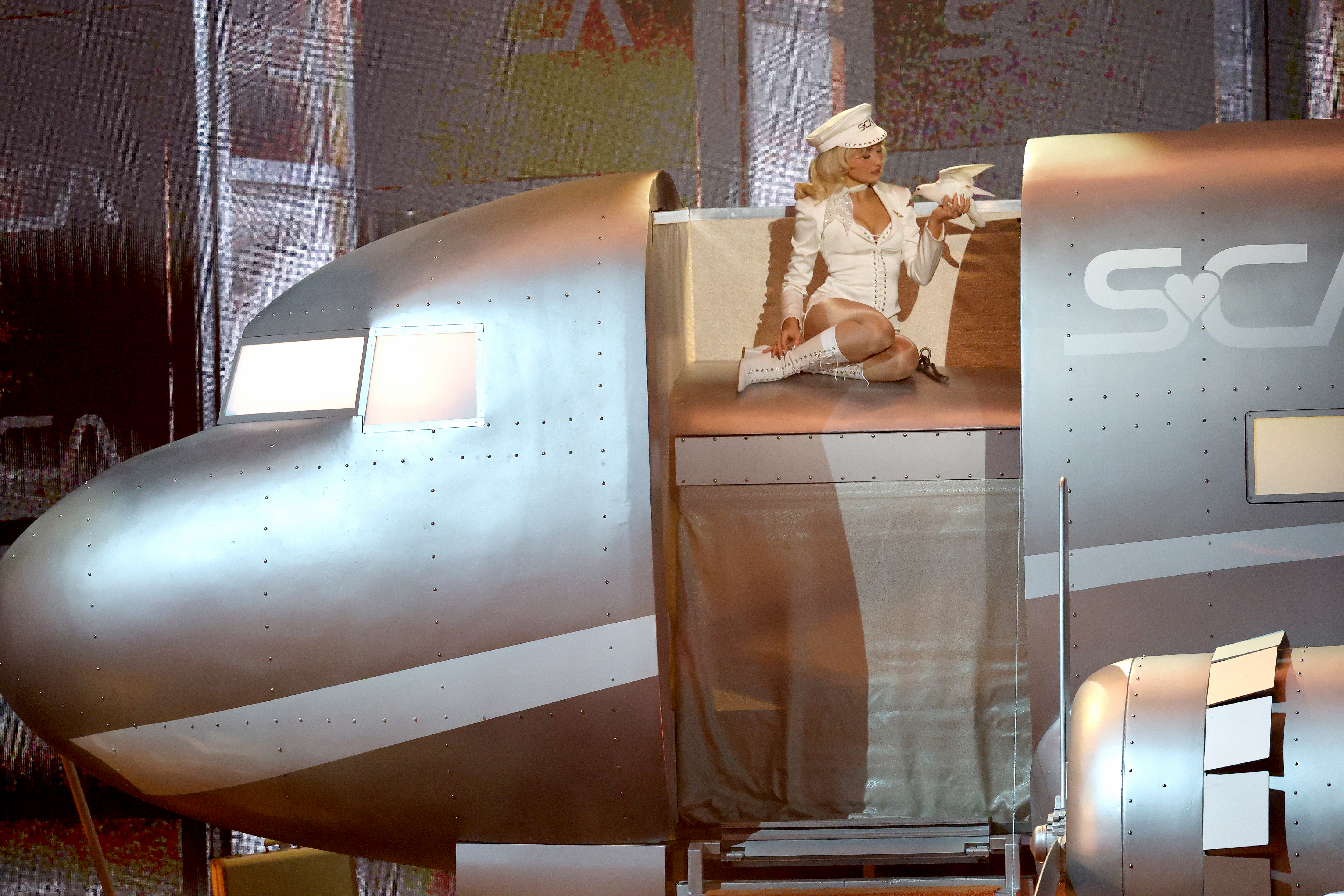 Sabrina Carpenter performed at the 2026 Grammy Awards in an all-white pilot-inspired matching set