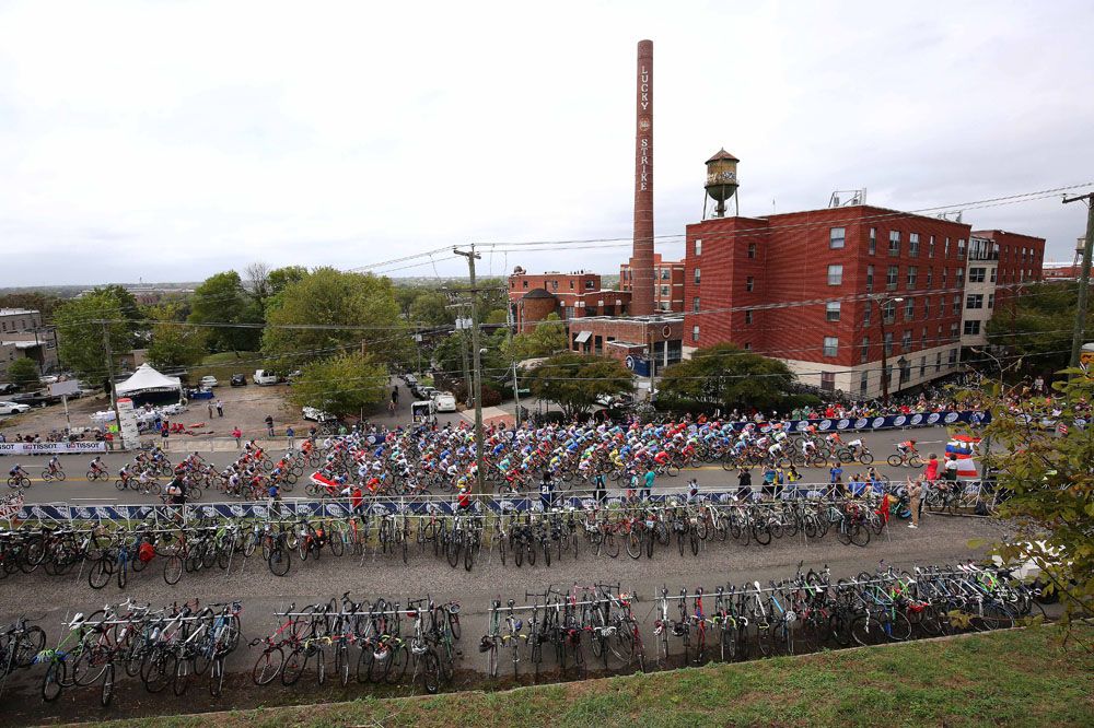 The peloton passes a bike valet for spectators