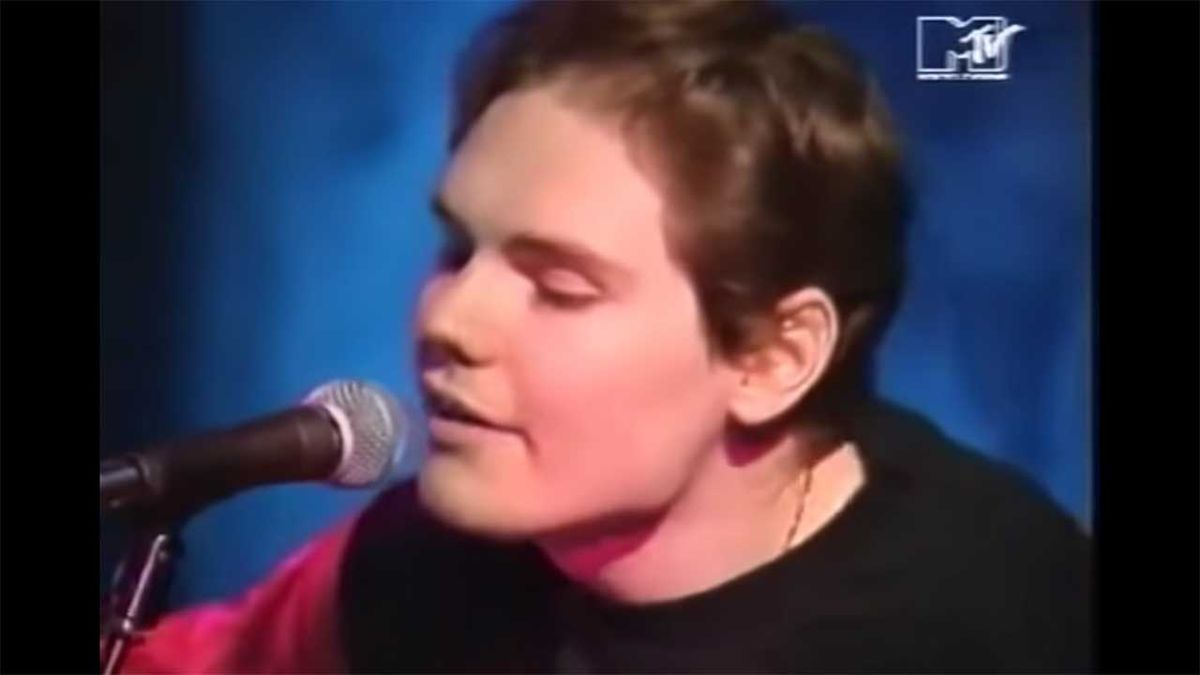 A screenshot of Billy Corgan performing with his guitar on MTV