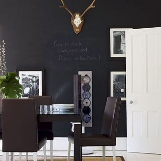 dining room with black wall