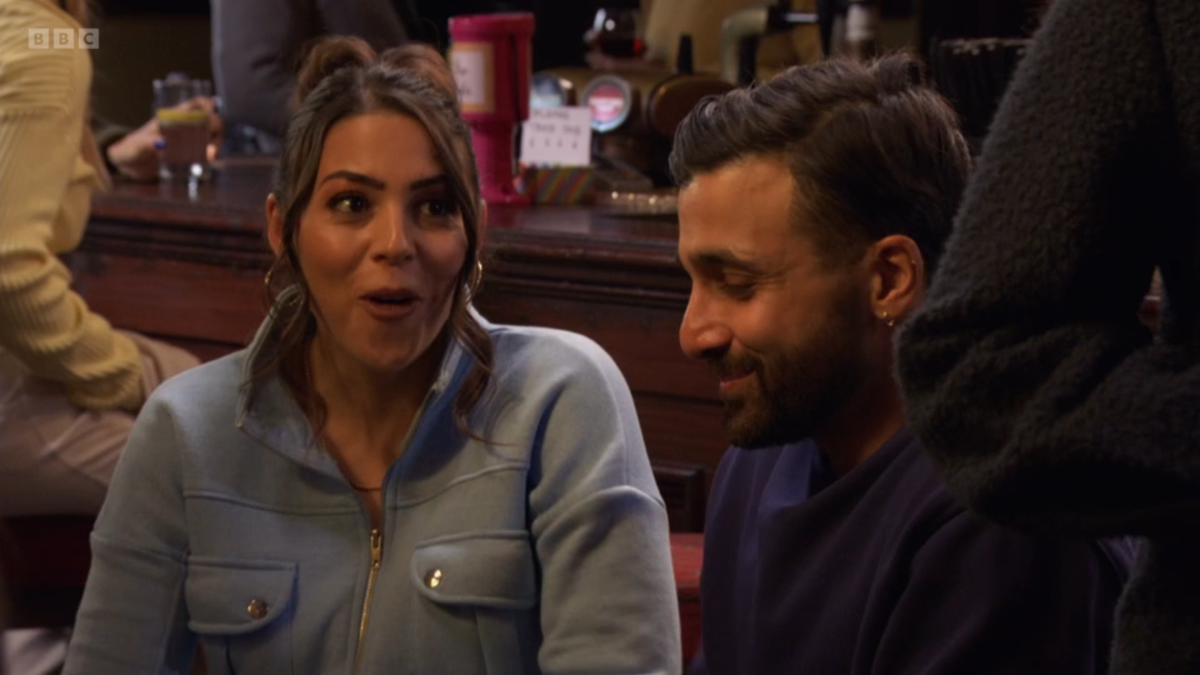 Priya Nandra-Hart and Vinny Panesar laughing at the Vic in EastEnders 