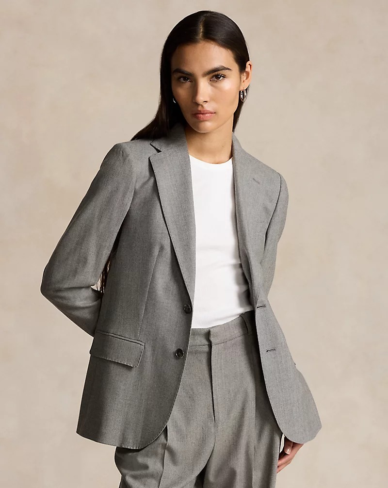 a model wearing a gray Ralph Lauren blazer with matching trousers