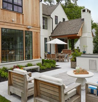 A backyard with dedicated seating areas for outdoor socializing