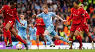 Manchester City’s Kevin De Bruyne is fouled by Liverpool’s Virgil van Dijk (right) during the Premier League match at the Etihad Stadium, Manchester. Picture date: Sunday April 10, 2022