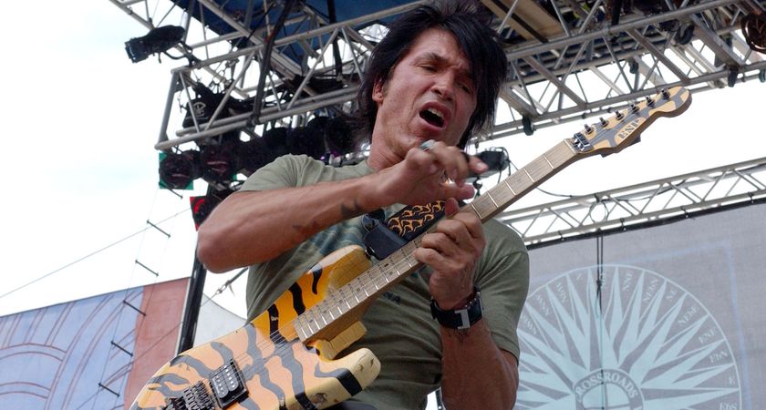 George Lynch goes two-handed on his tiger-striped signature ESP.