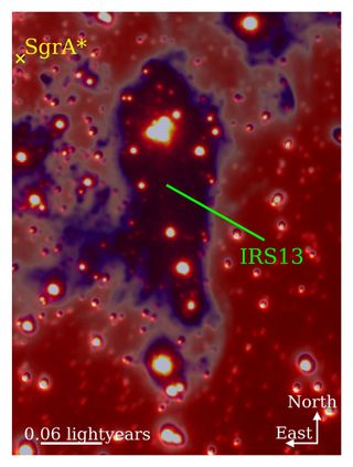 A large purple blob with glowing red and orange spheres within it