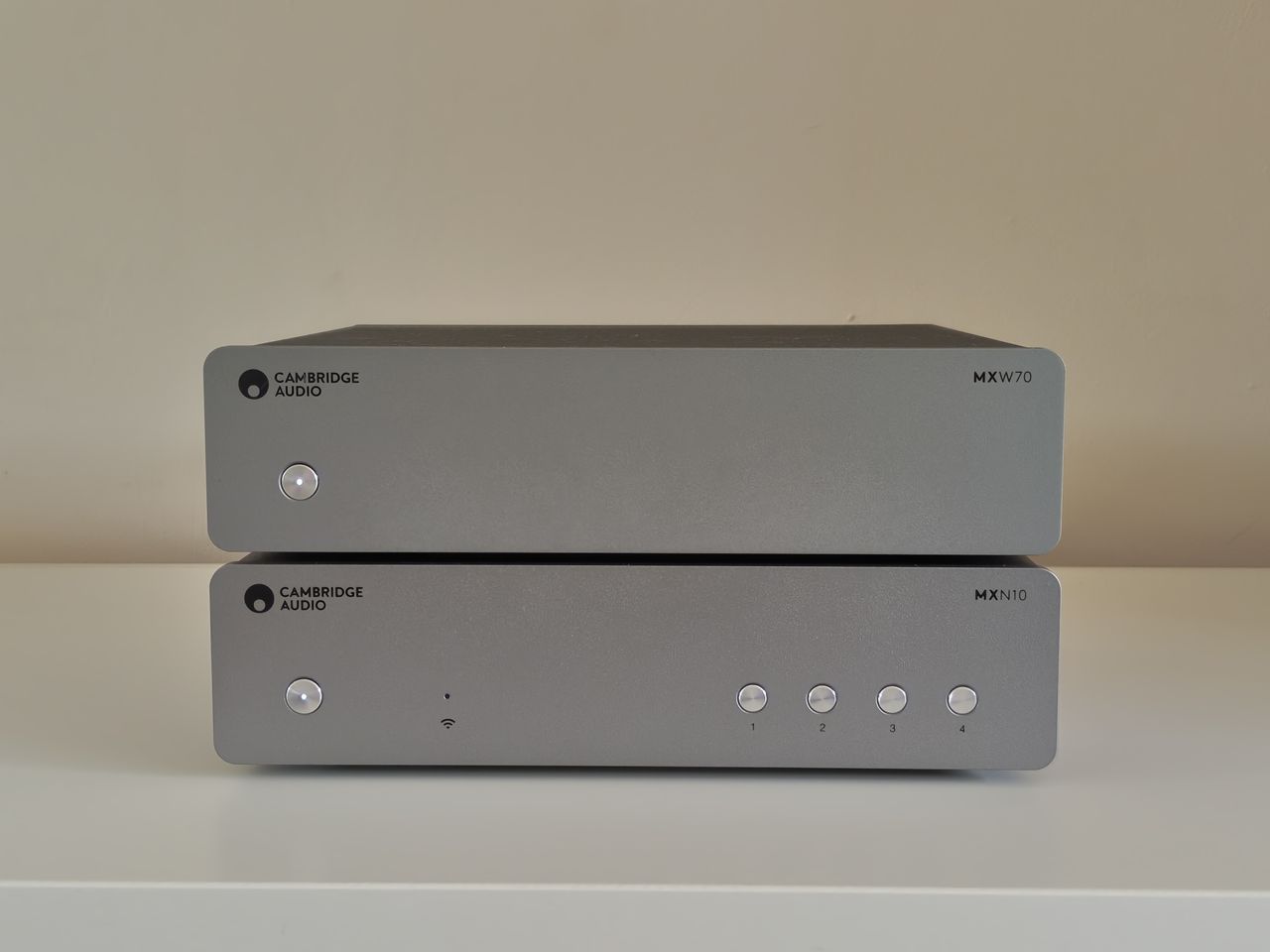 Cambridge Audio MXW70 power amp on book shelf with streamer