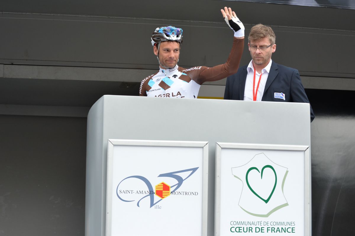 Jean-Christophe Peraud waves from the stage