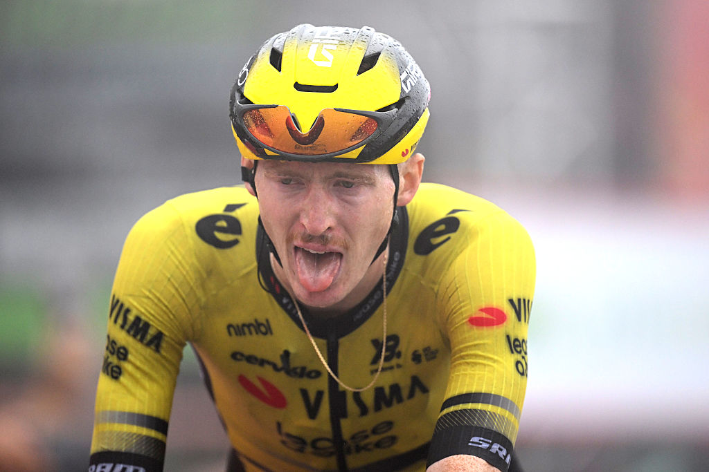Photo of Matteo Jorgenson riding with his tongue out from the effort