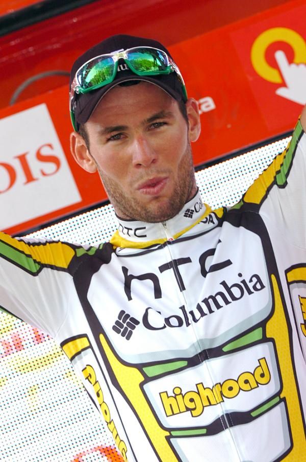 Mark Cavendish celebrates on the podium in Salamanca.