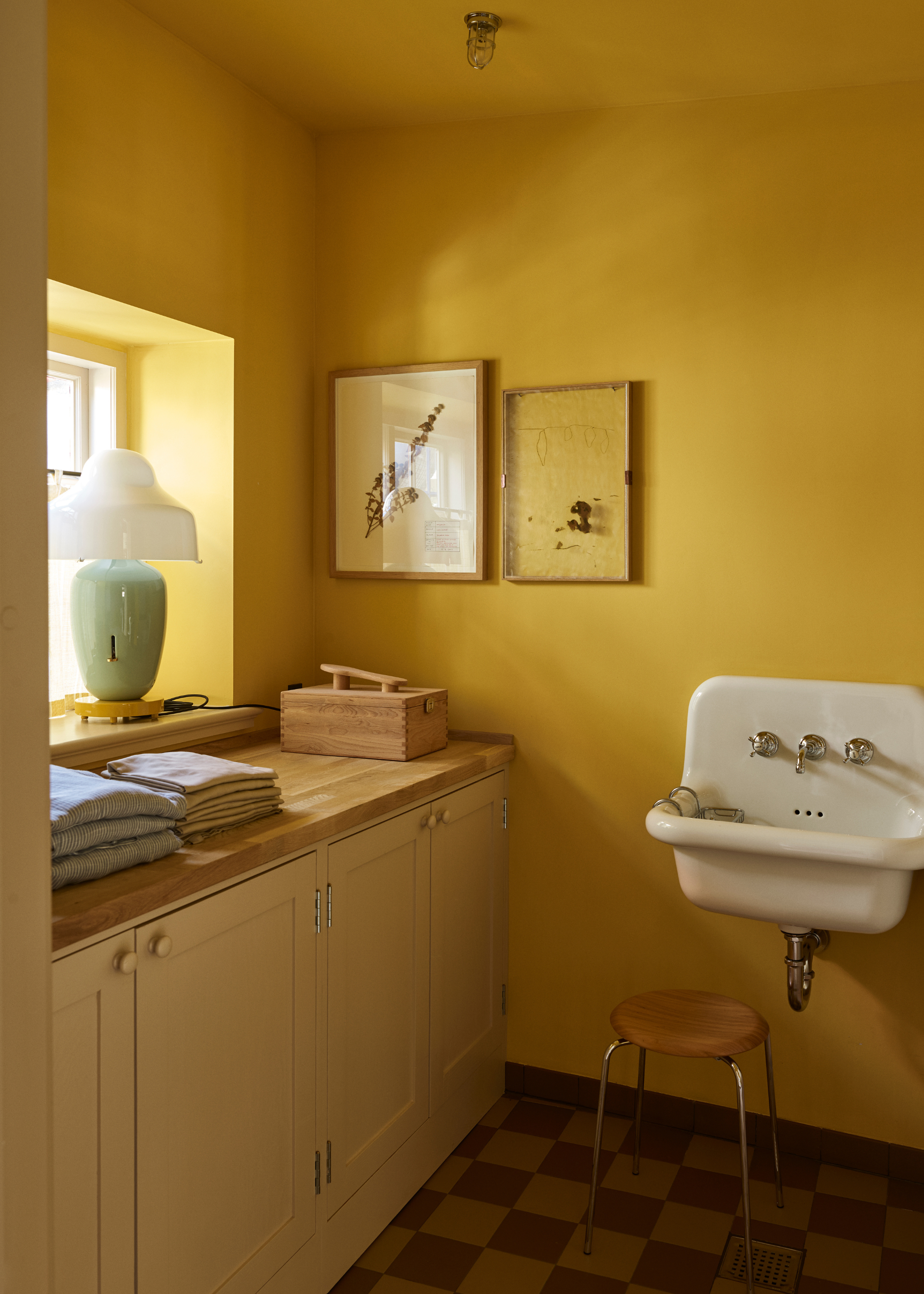 light yellow cabinets in a bright yellow room