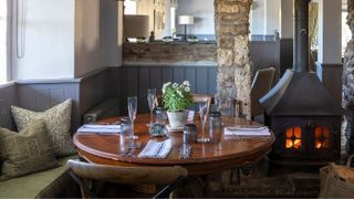 The dining room has period features and rustic charm
