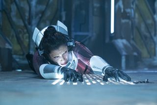 Nhan scrambles for her breather device after she's attacked by Airiam in the Section 31 HQ.