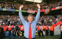 Arsene Wenger celebrates in front of the Arsenal fans after winning the title at White Hart Lane