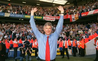 Arsene Wenger celebrates in front of the Arsenal fans after winning the title at White Hart Lane