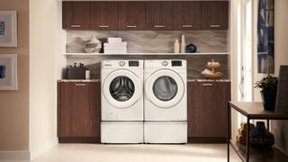 Samsung WF42H5000AW front load washer in kitchen beside matching dryer