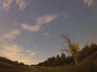 Amateur astronomer Monika Landy-Gyebnar snapped this photo of an Orionid meteor (top left) streaking over a field east of her hometown of Veszprem, Hungary on Oct. 22, 2011 during the peak of the annual Orionid meteor shower.