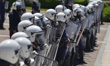 Riot police protect the Greek Parliament during austerity protests: With other EU countries not far behind, Greece&amp;#039;s meltdown is sending the global economy into a tailspin.