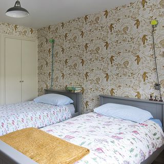 bedroom with wallpaper and beds