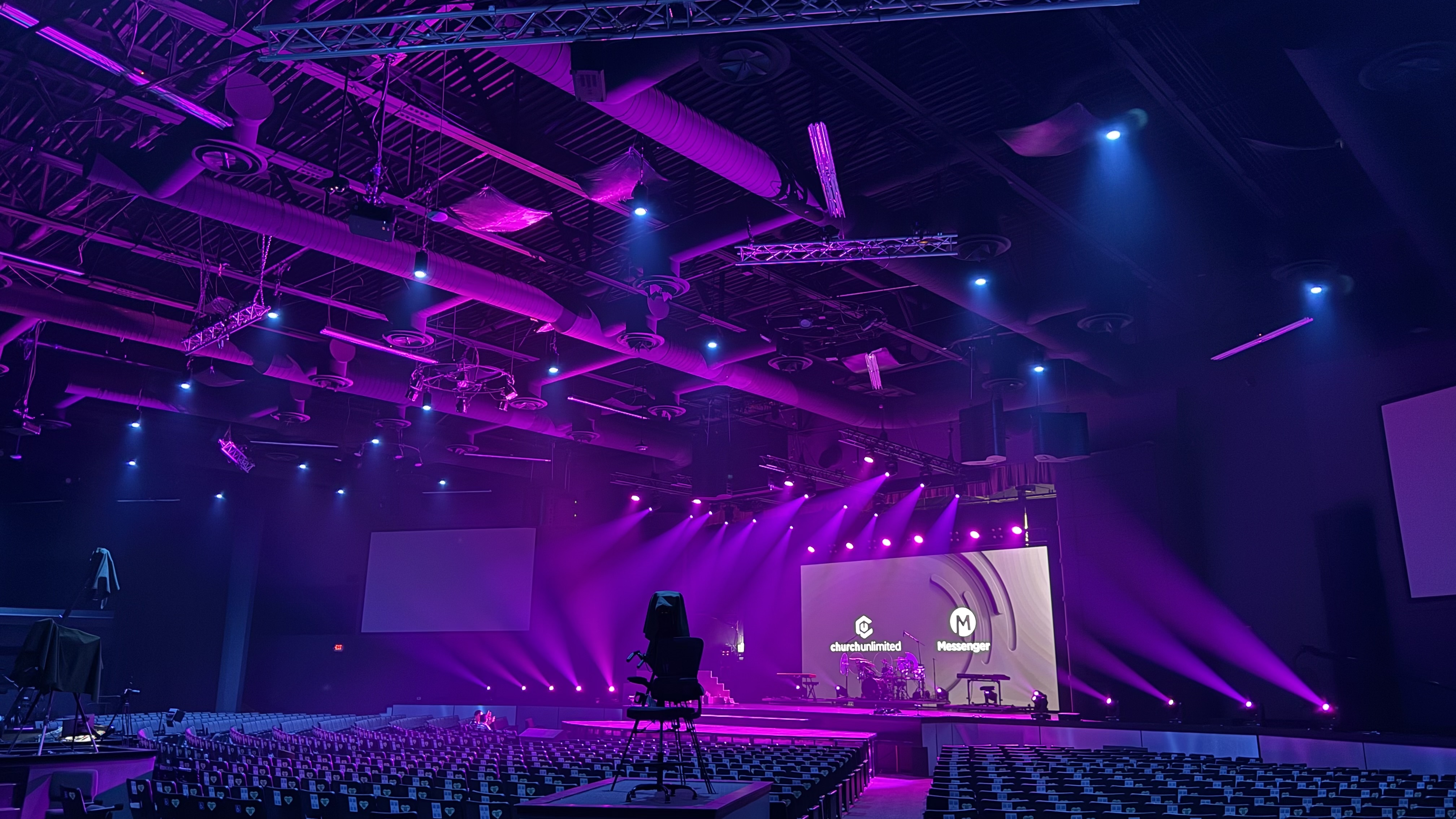 The Church Unlimited's stage, alit in purple and blue hues, is brought to life acoustically with EAW.