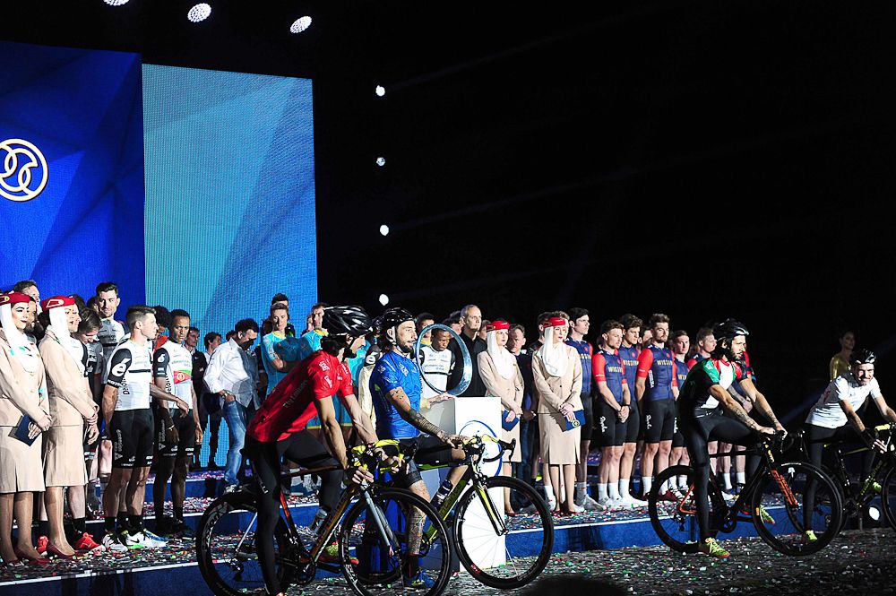 Performers and teams on stage in Dubai.