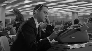 Jack Lemmon plays an officer worker killing time at his desk in The Apartment