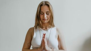 Woman breathing deeply in yoga pose