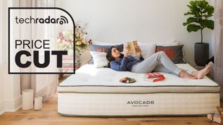 Woman relaxing on Avocado Green mattress with deals graphic overlaid