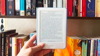 the kobo clara colour photographed against a bookshelf showing the color screen