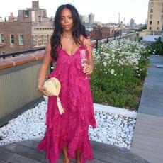 sierra mayhew wearing a wedding guest dress