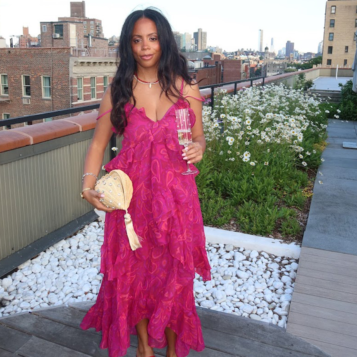 sierra mayhew wearing a wedding guest dress