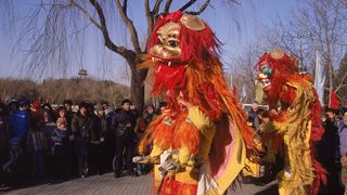 Dancers dressed as traditional Chinese dragons at an annual temple festival