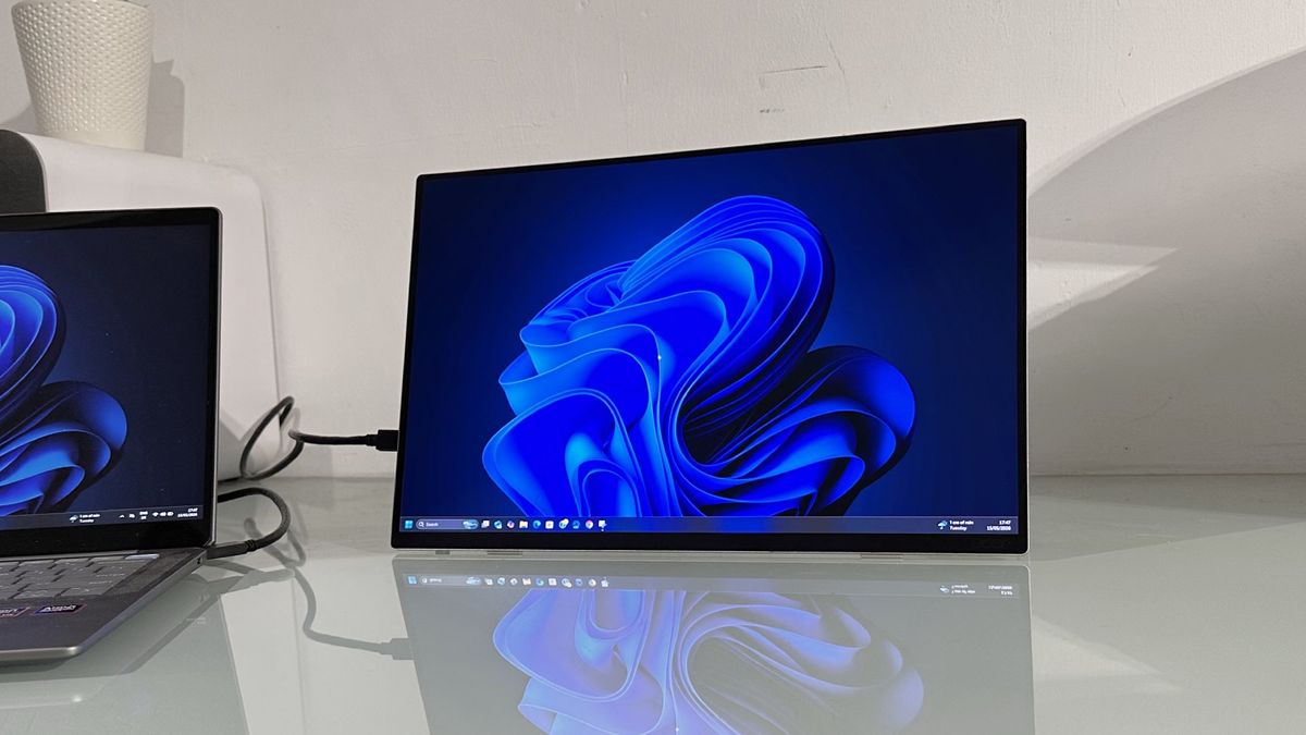 Testing the Acer ProDesigner PE160WUT in a home office next to a MacBook