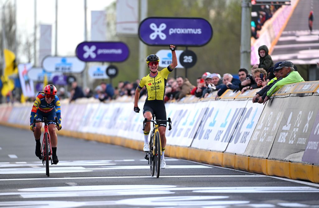 WAREGEM BELGIUM MARCH 27 Marianne Vos of The Netherlands and Team VismaLease a Bike celebrates at finish line as race winner ahead of Shirin van Anrooij of The Netherlands and Team Lidl Trek L during the 12nd Dwars door Vlaanderen 2024 Womens Elite a 1299km one day race from Waregem to Waregem on March 27 2024 in Waregem Belgium Photo by Tim de WaeleGetty Images