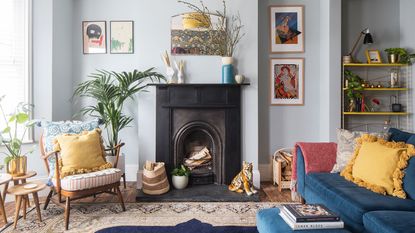 blue living room with black fireplace