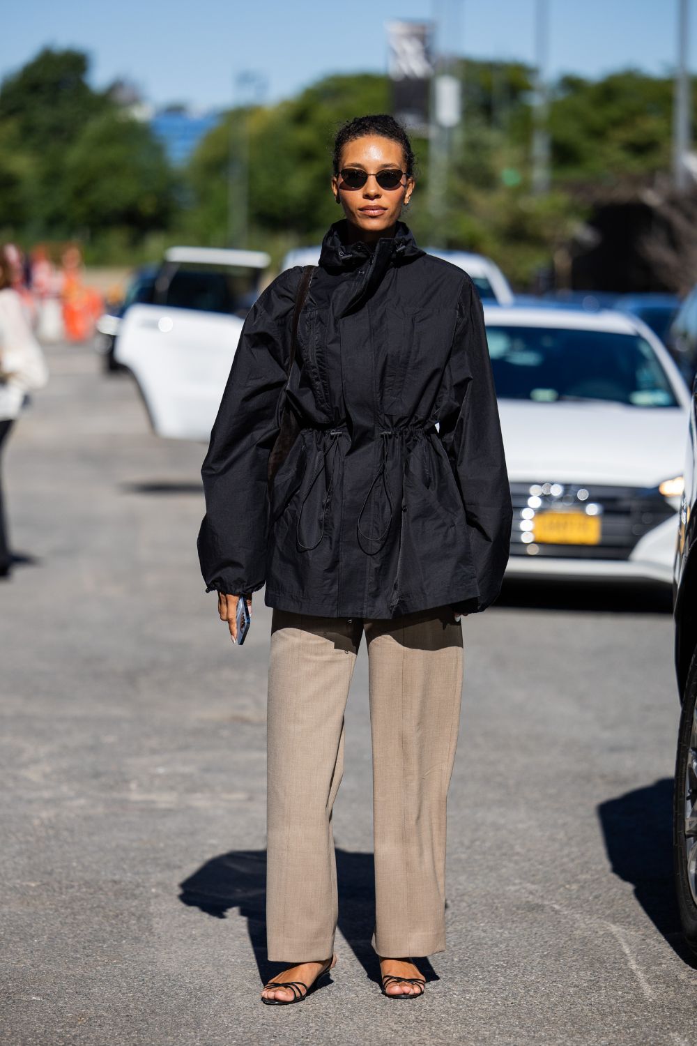 street style shot of woman wearing a utility jacket