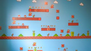 A Super Mario accent wall made with blue paint and decals