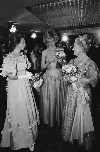 Princess Anne, Princess Diana (1961 - 1997) and The Queen Mother (1900 - 2002), wearing evening gowns, at the premiere of David Lean's film 'A Passage To India', London, UK, 18th March 1985