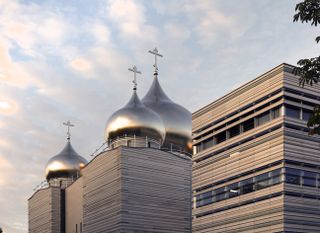A close-up of the three domes on top of the Russian Orthodox Spiritual and Cultural Centre