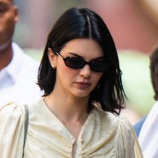 Kendall Jenner wears a butter yellow dress with sunglasses in New York City