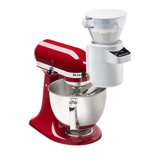Red stand mixer with white attachment